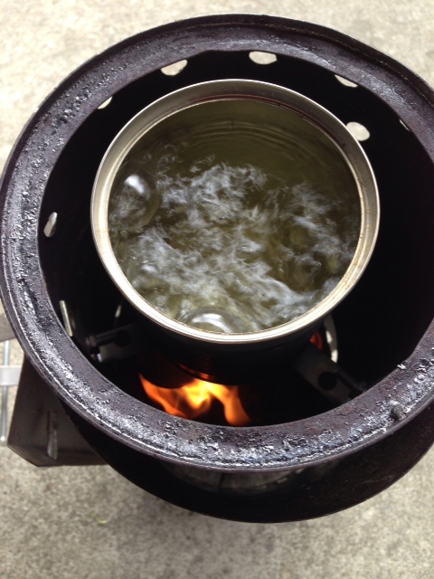 Pot in the flue as was done in the Swiss Volcano Stove.